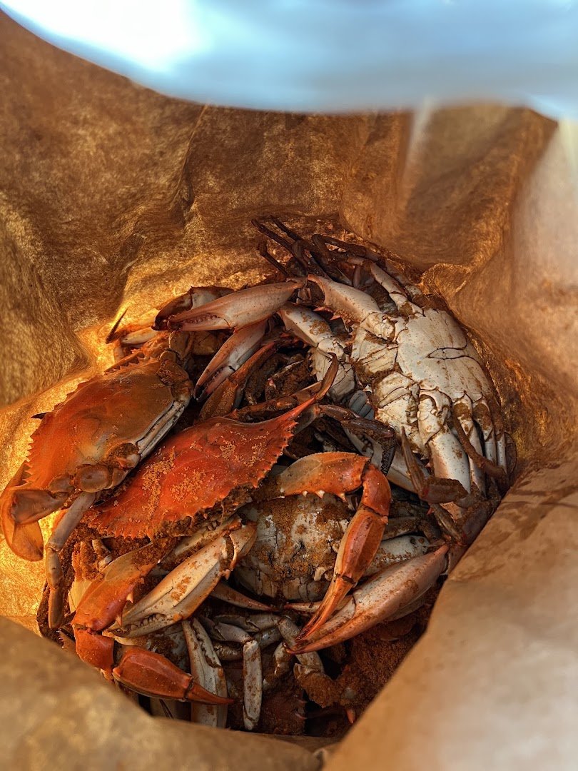 Fresh seafood combo trays on display.